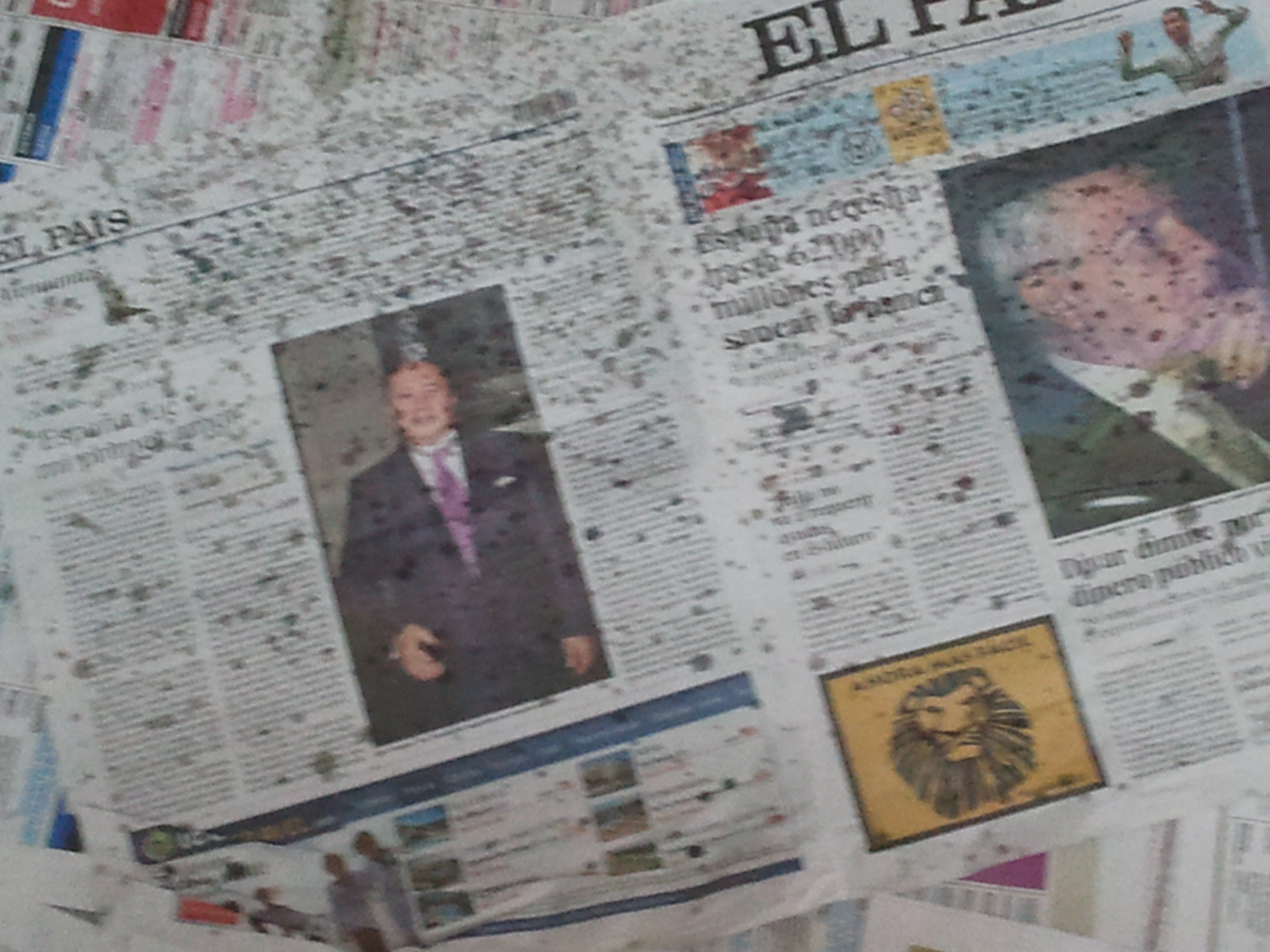 Detail of newspapers with oil stains